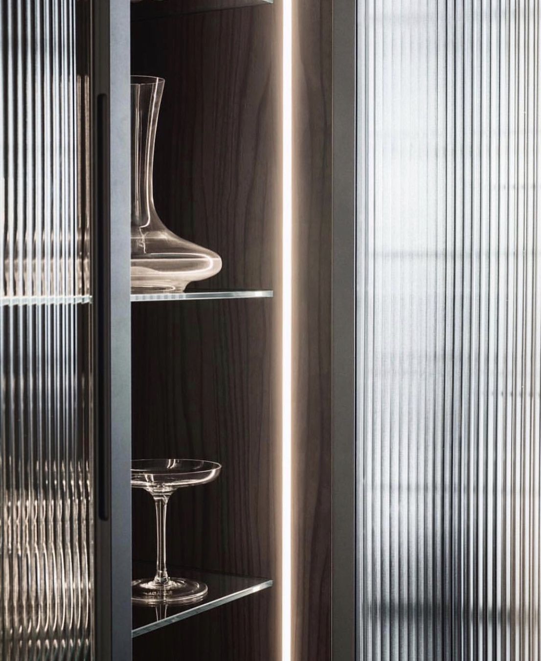Luxury kitchen with LED strip lighting, aluminum frame glass doors, and marble benchtops BY BOOLALA